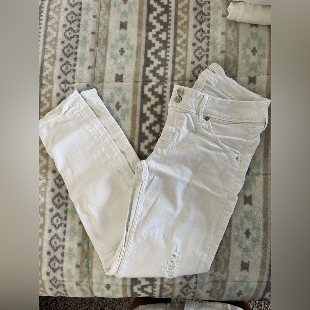 Distressed white jeans